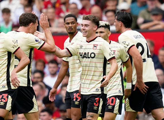 Manchester, England, 30th August 2026. Leif Davis of Ipswich Town (c) celebrates scoring the first goal during the Manchester United, ManU vs Ipswich Town Premier League match at Old Trafford, Manchester. Picture credit should read: Andrew Yates Sportimage EDITORIAL USE ONLY. No use with unauthorised audio, video, data, fixture lists, club league logos or live services. Online in-match use limited to 120 images, no video emulation. No use in betting, games or single club league player publications. SPI_037_AY_Man_Utd_Ipswich SPI-4945-0037