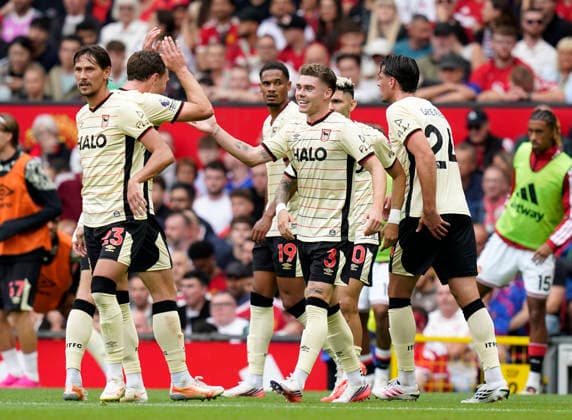 Manchester, England, 30th August 2026. Leif Davis of Ipswich Town (c) celebrates scoring the first goal during the Manchester United, ManU vs Ipswich Town Premier League match at Old Trafford, Manchester. Picture credit should read: Andrew Yates Sportimage EDITORIAL USE ONLY. No use with unauthorised audio, video, data, fixture lists, club league logos or live services. Online in-match use limited to 120 images, no video emulation. No use in betting, games or single club league player publications. SPI_040_AY_Man_Utd_Ipswich SPI-4945-0040
