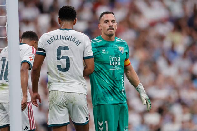 Jude Bellingham of Real Madrid CF and Alfonso Herrero of Málaga CF make gestures during the LaLiga EA Sports match between Real Madrid CF and Málaga CF at Estadio Santiago Bernabéu on August 30, 2026, in Madrid, Spain. Photo by Manu Reino, DeFodi Images