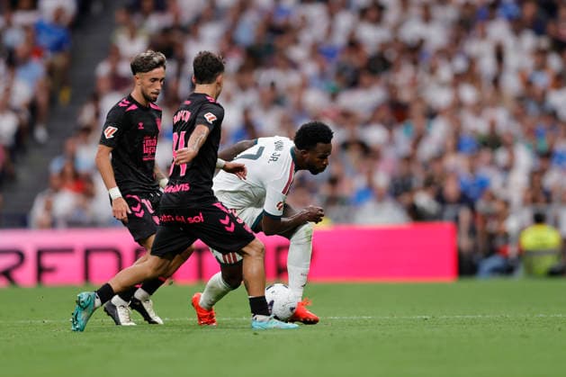 Vinicius Jr. of Real Madrid CF controls the ball under pressure during the LaLiga EA Sports match between Real Madrid CF and Málaga CF at Estadio Santiago Bernabéu on August 30, 2026, in Madrid, Spain. Photo by Manu Reino, DeFodi Images
