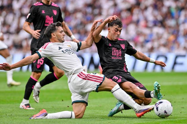 August 30, 2026, Madrid, Madrid, Spain: 21 BRAHIM DIAZ of Real Madrid CF and RAFITA (RAFA GARRIDO) of Malaga CF in action during the match on Matchday 3 of the 2026-27 National League First Division Championship between REAL MADRID C.F. and MALAGA CF, played at the Bernabeu Stadium on August 30, 2026, in Madrid, Spain. Madrid Spain - ZUMAc312 20260830_zsp_c312_062 Copyright: xOscarxManuelxSanchezx