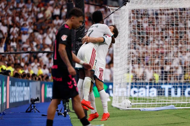 Arda Güler of Real Madrid CF celebrates with his teammates after scoring his team s fourth goal during the LaLiga EA Sports match between Real Madrid CF and Málaga CF at Estadio Santiago Bernabéu on August 30, 2026, in Madrid, Spain. Photo by Manu Reino, DeFodi Images