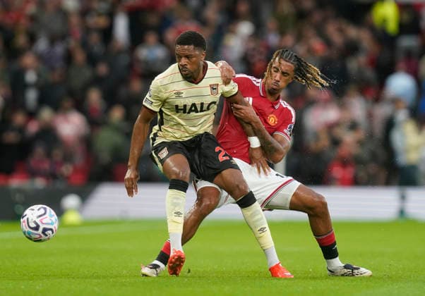 Manchester, England, 30th August 2026. Chuba Akpom of Ipswich Town tussles with Leny Yoro of Manchester United, ManU during the Manchester United vs Ipswich Town Premier League match at Old Trafford, Manchester. Picture credit should read: Andrew Yates Sportimage EDITORIAL USE ONLY. No use with unauthorised audio, video, data, fixture lists, club league logos or live services. Online in-match use limited to 120 images, no video emulation. No use in betting, games or single club league player publications. SPI_088_AY_Man_Utd_Ipswich SPI-4945-0089