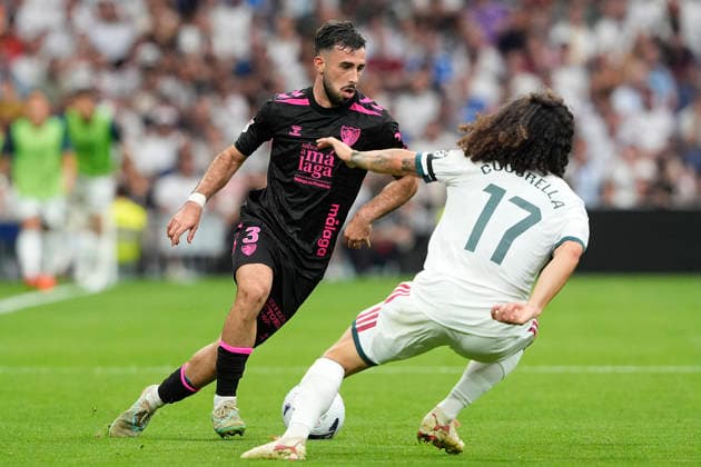 REAL MADRID CF v MALAGA CF. LA LIGA 2026 2027. ROUND 3. Real Madrid CF™s Marc Cucurella (r) and Malaga CF s Carlos Puga during La Liga match. August 30, 2026. (ALTERPHOTOS Acero) MadridSpain  Copyright: xAcerox