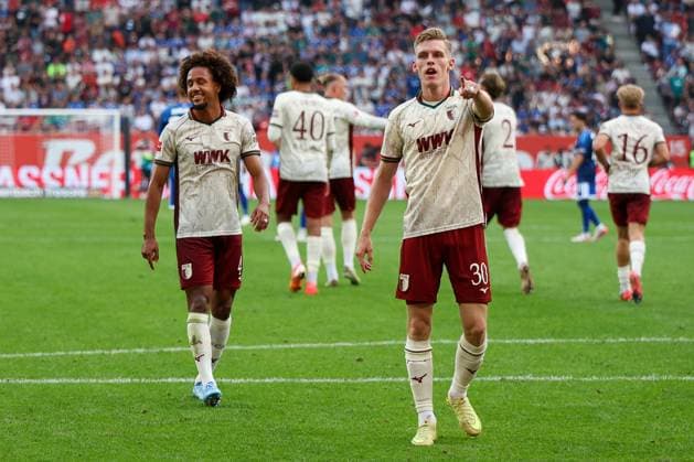 Anton Kade 30 (FC Augsburg) jubelt ueber sein Tor zum 2:0, mit Han-Noah Massengo 4 FC Augsburg), FC Augsburg vs. FC Schalke 04, Fussball, Maenner, Bundesliga, Saison 2026 2027, Hinrunde, 1. Spieltag, 30.08.2026 DFB regulations prohibit any use of photographs as image sequences and or quasi-video Augsburg Bayern Deutschland *** Anton Kade (30, FC Augsburg) celebrates his goal to make it 2–0, with Han Noah Massengo (4, FC Augsburg); FC Augsburg vs. FC Schalke 04; soccer; men s; Bundesliga; 2026–2027 season; First Half of the Season, Matchday 1, August 30, 2026. DFB regulations prohibit any use of photographs as image sequences and or quasi-video. Augsburg, Bavaria, Germany Copyright: xkolbert-press MartinxAgüerax