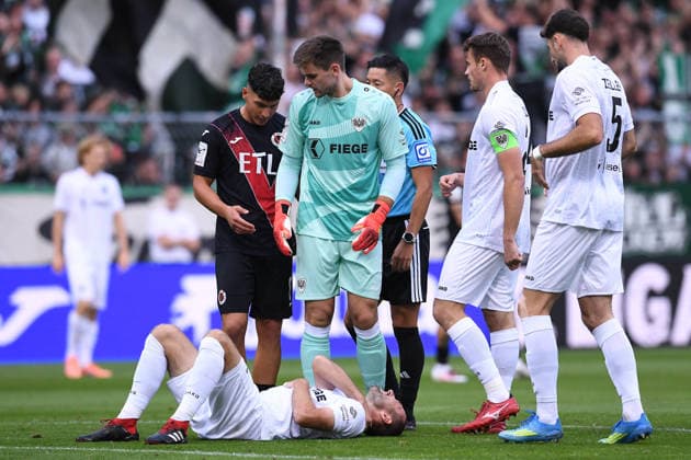 Soccer, 3rd Division, Matchday 3: FC Viktoria Köln vs. SC Preußen Münster on August 30, 2026, at Sportpark Höhenberg in Cologne. Rico Preißinger (Münster) lies injured on the ground. DFB regulations prohibit any use of photographs as image sequences and or quasi-video. xRx