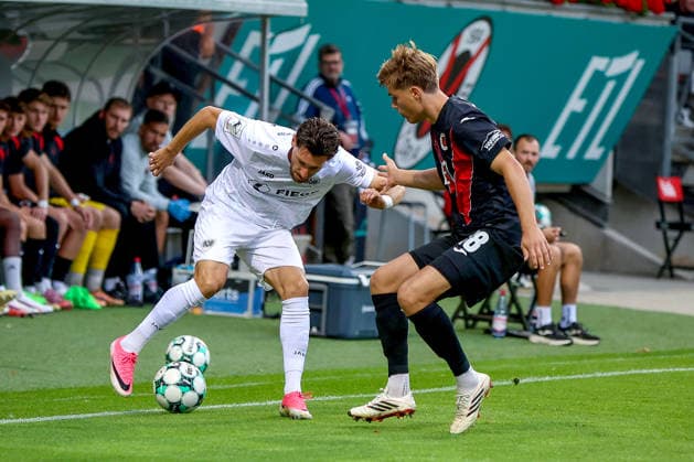 August 30, 2026, xsscx, German 3rd Division, Viktoria Cologne vs. Preußen Münster, Matchday 3, Sportpark Höhenberg, 2026–2027 Season: Charalambos Makridis of SC Preußen Münster (No. 14) in a tackle against Taylan Duman of Viktoria Köln (No. 8). DFB regulations prohibit any use of photographs as image sequences and or quasi-video. Photo: xSandraxScherningxPressefotoKochx, North Rhine-Westphalia Germany
