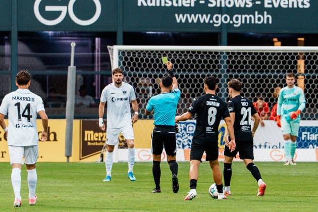 Germany Men s Soccer 3rd Division 2026–2027, Matchday 3: FC Viktoria Köln vs. SC Preußen Münster, Cologne. Referee Ryo Tanimoto (Japan), FIFA Referee, shows a yellow card, foul, caution against Lucas Zeller of SC Preußen Münster, 5 Copyright: xThiemoxRudolphx
