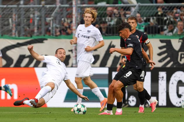 Rico Preissinger of SC Preussen Münster and Taylan Duman of FC Viktoria Köln battle for the ball during the 3. Liga match between Viktoria Köln and Preussen Münster at Sportpark Höhenberg on August 30, 2026, in Cologne, Germany. Photo by Oliver Kaelke, DeFodi Images. Rico Preissinger of SC Preussen Muenster and Taylan Duman of FC Viktoria Koeln battle for the ball during the 3. Liga match between Viktoria Koeln and Preussen Muenster at Sportpark Höhenberg on August 30, 2026 in Cologne, Germany. Photo by Oliver Kaelke, DeFodi Images. DFB and DFL regulations prohibit any use of photographs as image sequences and or quasi-video. Photo by Oliver Kaelke, DeFodi Images.