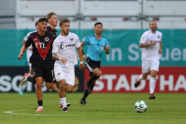 Taylan Duman of FC Viktoria Cologne and Louis Kolbe of SC Preussen Münster battle for the ball during the 3. Liga match between Viktoria Cologne and Preussen Münster at Sportpark Höhenberg on August 30, 2026, in Cologne, Germany. Photo by Oliver Kaelke, DeFodi Images. Taylan Duman of FC Viktoria Cologne and Louis Kolbe of SC Preussen Münster battle for the ball during the 3. Liga match between Viktoria Cologne and Preussen Münster at Sportpark Höhenberg on August 30, 2026 in Cologne, Germany Photo by Oliver Kaelke DeFodi Images DFB and DFL regulations prohibit any use of photographs as image sequences and or quasi-video Photo by Oliver Kaelke DeFodi Images