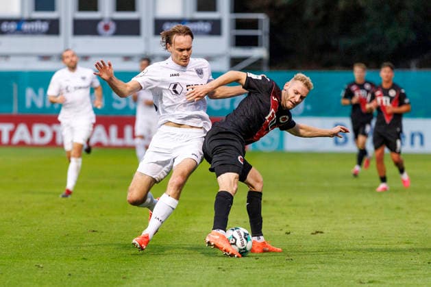 KOELN, GERMANY - AUGUST 30, 2026: Ryan Johannson (Preußen Münster, 20) and Meiko Sponsel (FC Viktoria Köln, 19) during the 3rd division match on gameday 3 between Viktoria Koeln vs. Preußen Muenster at the Sportpark Hoehenberg on August 30, 2026 in Koeln, Germany. DFL REGULATIONS PROHIBIT ANY USE OF PHOTOGRAPHS AS IMAGE SEQUENCES AND OR QUASI-VIDEO. Nordrhein-Westfalen Germany Copyright: xLeahxKohringx