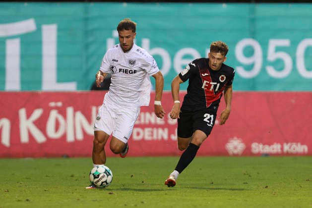 Louis Kolbe of SC Preussen Münster and Lucas Wolf of FC Viktoria Köln battle for the ball during the 3. Liga match between Viktoria Köln and Preussen Münster at Sportpark Höhenberg on August 30, 2026, in Cologne, Germany. Photo by Oliver Kaelke, DeFodi Images. Louis Kolbe of SC Preussen Münster and Lucas Wolf of FC Viktoria Cologne battle for the ball during the 3. Liga match between Viktoria Cologne and Preussen Münster at Sportpark Höhenberg on August 30, 2026 in Cologne, Germany. Photo by Oliver Kaelke, DeFodi Images. DFB and DFL regulations prohibit any use of photographs as image sequences and or quasi-video. Photo by Oliver Kaelke, DeFodi Images.