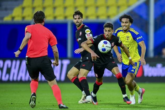LEEUWARDEN , 30-08-2026 , Kooi Stadium , season 2026 2027 , Dutch Eredivisie football , match between SC Cambuur and FC Twente , picture shows FC Twente player Younes Taha SC Cambuur player Sami Bouhoudane Cambuur - Twente  x206259269x Copyright: