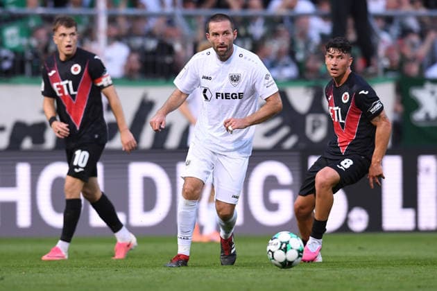 Soccer, 3rd Division, Matchday 3: FC Viktoria Köln vs. SC Preußen Münster on August 30, 2026, at Sportpark Höhenberg in Cologne. Rico Preißinger (Münster) in the foreground; Taylan Duman (Cologne) in the background. DFB regulations prohibit any use of photographs as image sequences and or quasi-video. xRx