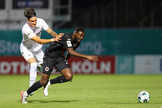 Antonio Tikvic of SC Preussen Münster and Verthomy Schilo Boboy of FC Viktoria Köln battle for the ball during the 3. Liga match between Viktoria Köln and Preussen Münster at Sportpark Höhenberg on August 30, 2026, in Cologne, Germany. Photo by Oliver Kaelke, DeFodi Images. Antonio Tikvic of SC Preussen Muenster and Verthomy Schilo Boboy of FC Viktoria Koeln battle for the ball during the 3. Liga match between Viktoria Koeln and Preussen Muenster at Sportpark Höhenberg on August 30, 2026 in Cologne, Germany. Photo by Oliver Kaelke, DeFodi Images. DFB and DFL regulations prohibit any use of photographs as image sequences and or quasi-video. Photo by Oliver Kaelke, DeFodi Images.