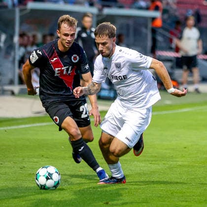 August 30, 2026, xsscx, German 3rd Division, Viktoria Köln vs. Preußen Münster, Matchday 3, Sportpark Höhenberg, 2026–2027 Season: Kilian Jakob (Viktoria Köln, No. 26) in a tackle against Charalambos Makridis (SC Preußen Münster, No. 14) and Tim Kloss (Viktoria Köln, No. 18). DFB regulations prohibit any use of photographs as image sequences and or quasi-video. Photo: xSandraxScherningxPress Photo: Koch, North Rhine-Westphalia, Germany