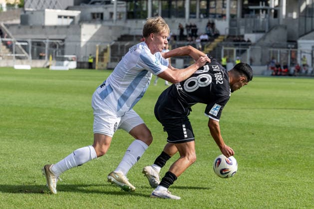 Battle for the Ball: Tackle between Fabio Wagner (TSV 1860 Munich, No. 09) and Halit Yilmaz (TSV 1882 Landsberg, No. 28), GER, TSV 1860 Munich vs. TSV Landsberg 1882, Soccer, Bavarian Regional League, Matchday 6, 2026–2027 Season, August 30, 2026 DFL and DFB regulations prohibit any use of photographs as image sequences and or quasi-video. Photo: HMB Media, Heike Feiner Copyright: HMBxMedia HeikexFeiner