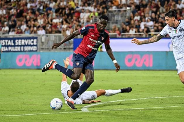 IPA87947460 - Hakan Calhanoglu of Inter and Paul Mendy of Cagliari Calcio during the Cagliari Calcio vs. Inter - FC Internazionale Italian Serie A soccer match in Cagliari, Italy, on August 30, 2026  Copyright: xLuigixCanu IPAxSportx xx 87947460