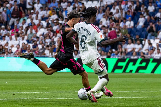 ESP Real Madrid CF vs. Málaga CF La Liga EA Sports David Larrubia of Málaga is defended by Eduardo Camavinga of Real Madrid during a La Liga EA Sports match between Real Madrid and Málaga CF at Estadio Santiago Bernabéu on August 30, 2026, in Madrid, Spain Madrid Madrid Spain Soccer Copyright: xAlejandroxMatiasx