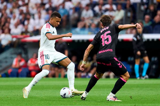 SOCCER- La Liga EA match between Real Madrid CF and Malaga CF at Santiago Bernabeu Stadium, on August 30, 2026. Kylian Mbappe of Real Madrid CF battles for the ball with Angel Recio of Malaga CF during the La Liga EA Sport match between Real Madrid CF and Malaga CF at Santiago Bernabeu Stadium, on August 30, 2026. Madrid Madrid Spain EDITORIAL USE ONLY Copyright: xx SENIS-CEBOLLAx xALFAQUIx dpphotos202048