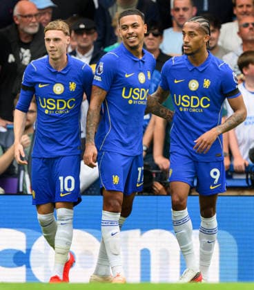 30 August 2026 - Chelsea v Brighton and Hove Albion - Premier League - Stamford Bridge - London. Chelsea v Brighton and Hove Albion - Premier League - Stamford Bridge - London. PPR. Joao Pedro celebrates his goal with fellow Chelsea forwards Morgan Rogers and Cole Palmer. Picture : Mark Pain LONDON England  Copyright: xMarkxPainx