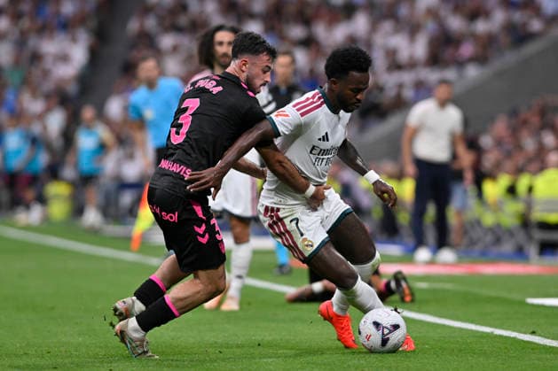 August 30, 2026, Madrid, Madrid, Spain: 7 VINICIUS JUNIOR of Real Madrid CF and CARLOS PUGA of Malaga CF disputes a ball during the match on Matchday 3 of the 2026-27 National League First Division Championship between REAL MADRID C.F. and MALAGA CF, played at the Bernabeu Stadium on August 30, 2026, in Madrid, Spain. REAL MADRID C.F. Vs. MALAGA CF - 2026 27 National League First Division Championship (08 30 26)  - ZUMAc312 20260830_zsp_c312_221 Copyright: xOscarxManuelxSanchezx