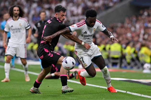 August 30, 2026, Madrid, Madrid, Spain: 7 VINICIUS JUNIOR of Real Madrid CF and CARLOS PUGA of Malaga CF disputes a ball during the match on Matchday 3 of the 2026-27 National League First Division Championship between REAL MADRID C.F. and MALAGA CF, played at the Bernabeu Stadium on August 30, 2026, in Madrid, Spain. REAL MADRID C.F. Vs. MALAGA CF - 2026 27 National League First Division Championship (08 30 26)  - ZUMAc312 20260830_zsp_c312_227 Copyright: xOscarxManuelxSanchezx