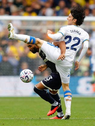 Leeds, England, 30th August 2026. Callum Wilson of Brentford and Ao Tanaka of Leeds United during the Leeds United vs Brentford Premier League match at Elland Road, Leeds. Picture credit should read: James Baylis Sportimage EDITORIAL USE ONLY. No use with unauthorised audio, video, data, fixture lists, club league logos or live services. Online in-match use limited to 120 images, no video emulation. No use in betting, games or single club league player publications. SPI_174_JB_LEEDS_BRENTFORD SPI-4950-0174