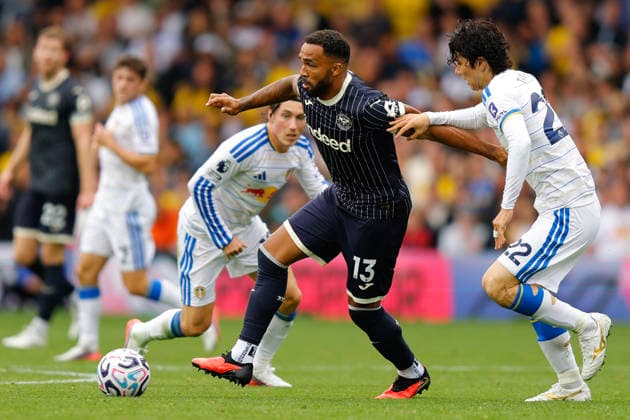 Leeds, England, 30th August 2026. Callum Wilson of Brentford and Ao Tanaka of Leeds United during the Leeds United vs Brentford Premier League match at Elland Road, Leeds. Picture credit should read: James Baylis Sportimage EDITORIAL USE ONLY. No use with unauthorised audio, video, data, fixture lists, club league logos or live services. Online in-match use limited to 120 images, no video emulation. No use in betting, games or single club league player publications. SPI_176_JB_LEEDS_BRENTFORD SPI-4950-0176