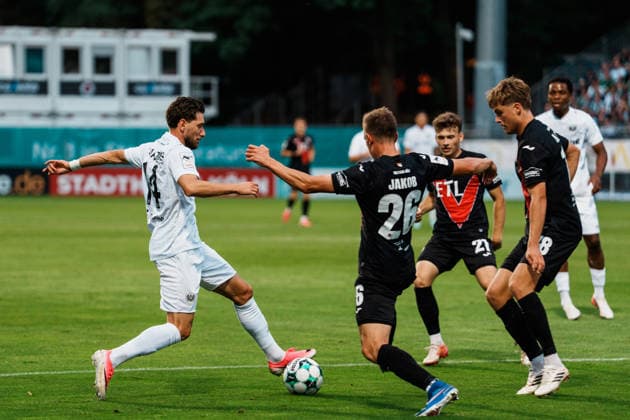 Germany Men s Soccer 3rd Division 2026–2027, Matchday 3: FC Viktoria Köln vs. SC Preußen Münster, Cologne: Charalambos Makridis (SC Preußen Münster), 14, dribbling, attacking, near the penalty area, in a tackle against Kilian Jakob (FC Viktoria Köln), 26, Pascal Armando Fallmann (FC Viktoria Köln), 28, Lucas Mika Wolf (FC Viktoria Köln), 21 Copyright: xThiemoxRudolphx