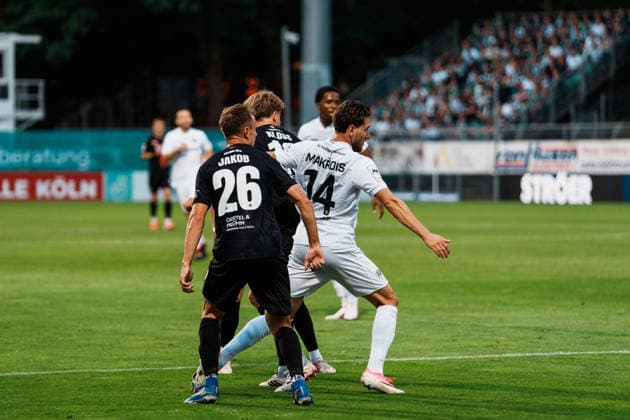 Germany Men s Soccer 3rd Division 2026–2027, Matchday 3: FC Viktoria Köln vs. SC Preußen Münster, Cologne—Charalambos Makridis (SC Preußen Münster), 14, dribbling, attacking, near the penalty area, in a tackle against Kilian Jakob (FC Viktoria Köln), 26, Pascal Armando Fallmann (FC Viktoria Köln), 28, Lucas Mika Wolf (FC Viktoria Köln), 21 Copyright: xThiemoxRudolphx