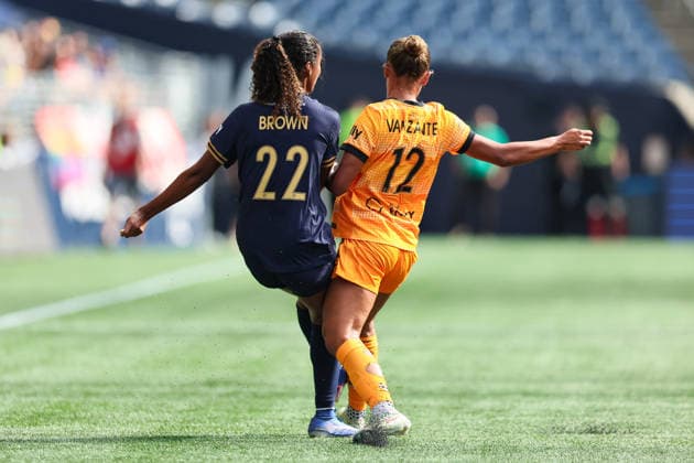 SEATTLE, WA - AUGUST 30: Defender Ryanne Brown 22 of the Seattle Reign collides with midfielder Kiki Van Zanten 12 of the Houston Dash during a game between the Houston Dash and Seattle Reign on August 30, 2026 at Lumen Field in Seattle, Washington. (Photo by Henry Rodenburg Icon Sportswire) SOCCER: AUG 30 NWSL Seattle Reign FC vs Houston Dash EDITORIAL USE ONLY Icon26083004