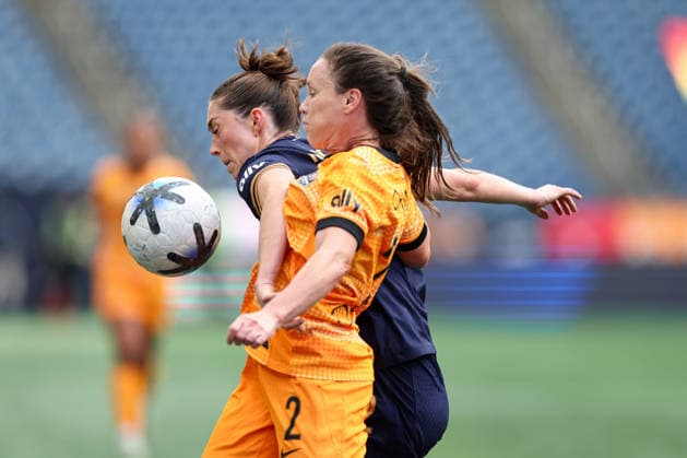 SEATTLE, WA - AUGUST 30: Forward Maddie Mercado 2 of the Seattle Reign and defender Allysha Chapman 2 of the Houston Dash battle for possession during a game between the Houston Dash and Seattle Reign on August 30, 2026 at Lumen Field in Seattle, Washington. (Photo by Henry Rodenburg Icon Sportswire) SOCCER: AUG 30 NWSL Seattle Reign FC vs Houston Dash EDITORIAL USE ONLY Icon26083005