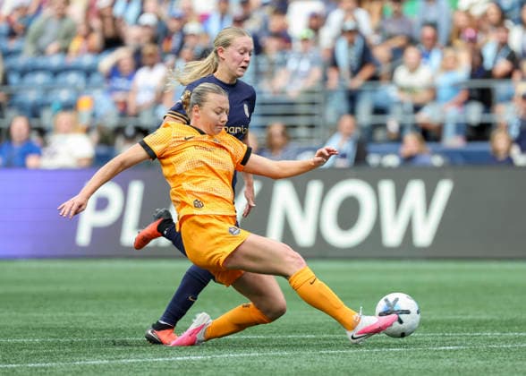 SEATTLE, WA - AUGUST 30: (left to right) Houston Dash defender Avery Patterson (15) kicks the ball away from Seattle Reign FC midfielder Angharad James-Turner (8) I the strike zone in the second half during the NWSL match between the Houston Dash and Seattle Reign FC on August 30, 2026 at Lumen Field in Seattle, Washington. (Photo by Leslie Plaza Johnson Icon Sportswire) SOCCER: AUG 30 NWSL Seattle Reign FC vs Houston Dash EDITORIAL USE ONLY Icon260830023