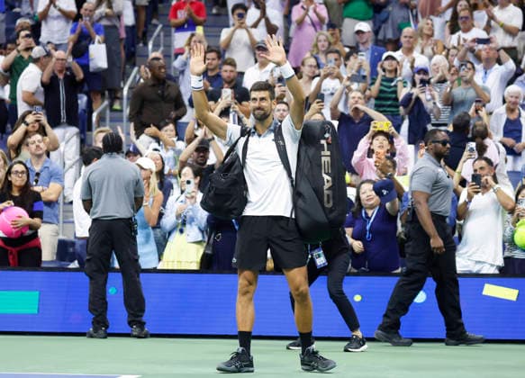 Fans watch Novak Djokovic of Serbia recast as he walks off of the court after his match against Mariano Navone of Argentina in Arthur Ashe Stadium in the first round at the 2026 US Open Tennis Championship at the USTA Billie Jean King National Tennis Center in New York City on Sunday, August 30, 2026. Navone defeated Djokovic in 5 sets.  NYP20260830154 JOHNxANGELILLO