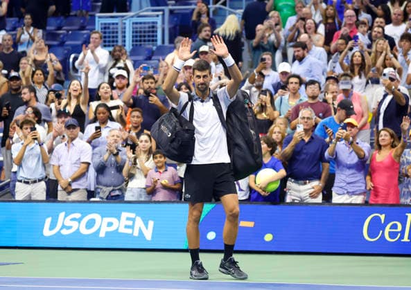Fans watch Novak Djokovic of Serbia recast as he walks off of the court after his match against Mariano Navone of Argentina in Arthur Ashe Stadium in the first round at the 2026 US Open Tennis Championship at the USTA Billie Jean King National Tennis Center in New York City on Sunday, August 30, 2026. Navone defeated Djokovic in 5 sets.  NYP20260830155 JOHNxANGELILLO