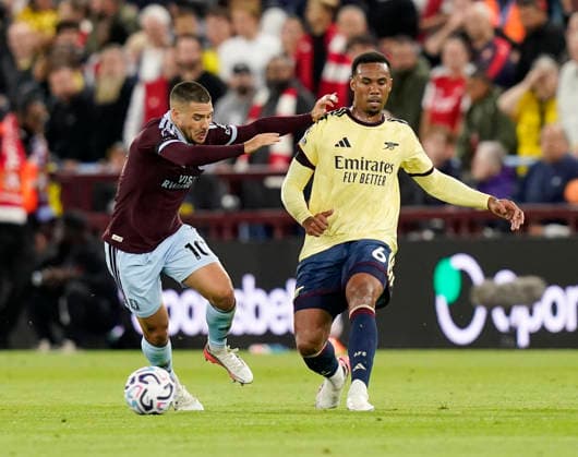 Birmingham, England, 31st August 2026. Emi Buendia of Aston Villa tussles with Gabriel of Arsenal during the Aston Villa vs Arsenal Premier League match at Villa Park, Birmingham. Picture credit should read: Andrew Yates Sportimage EDITORIAL USE ONLY. No use with unauthorised audio, video, data, fixture lists, club league logos or live services. Online in-match use limited to 120 images, no video emulation. No use in betting, games or single club league player publications. SPI_029_AY_Villa_Arsenal SPI-4946-0029