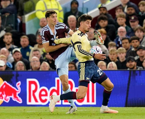 Birmingham, England, 31st August 2026. Pau Torres of Aston Villa challenges Kai Havertz of Arsenal during the Aston Villa vs Arsenal Premier League match at Villa Park, Birmingham. Picture credit should read: Andrew Yates Sportimage EDITORIAL USE ONLY. No use with unauthorised audio, video, data, fixture lists, club league logos or live services. Online in-match use limited to 120 images, no video emulation. No use in betting, games or single club league player publications. SPI_048_AY_Villa_Arsenal SPI-4946-0048