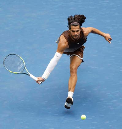 Carlos Alcaraz of Spain sprints in an attempt to return a ball in his first round match against Roman Safiullin in Arthur Ashe Stadium at the 2026 US Open Tennis Championship at the USTA Billie Jean King National Tennis Center in New York City on Monday, August 31, 2026. Alcaraz defeated Safiullin in straight sets to advance to the second round.  NYP20260831105 JOHNxANGELILLO