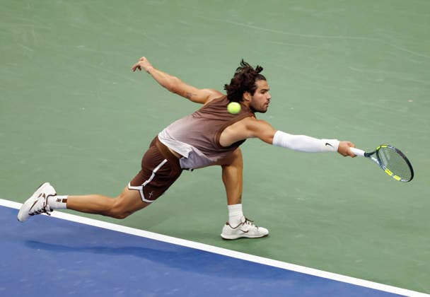 Carlos Alcaraz of Spain reaches to return a ball to Roman Safiullin in Arthur Ashe Stadium at the 2026 US Open Tennis Championship at the USTA Billie Jean King National Tennis Center in New York City on Monday, August 31, 2026. Alcaraz defeated Safiullin in straight sets to advance to the second round.  NYP20260831109 JOHNxANGELILLO