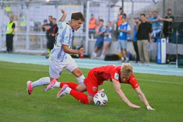 Jonas WESELSBERGER, Buchbach; Action: Tackle against Mark GEVORGYAN, TSV 1860 Munich; Bavarian State Soccer Cup, Toto Cup: TSV 1860 Munich vs. TSV Buchbach on September 1, 2026, at Gruenwalder Stadium
