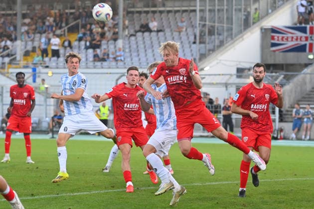 Jonas WIESELSBERGER (Buchbach), in action, in a tackle against Fabio WAGNER (TSV 1860 Munich), left: Julian BELL (TSV 1860 Munich); a scene in the penalty area during a soccer match in the Bavarian State Cup, Toto Cup: TSV 1860 Munich vs. TSV Buchbach on September 1, 2026, at Grünwalder Stadium