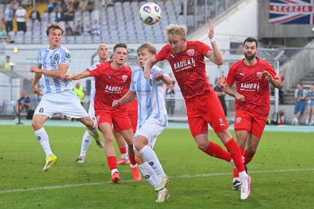 Jonas WIESELSBERGER (Buchbach), in action, in a tackle against Fabio WAGNER (TSV 1860 Munich), left: Julian BELL (TSV 1860 Munich); a scene in the penalty area during a soccer match in the Bavarian State Cup, Toto Cup: TSV 1860 Munich vs. TSV Buchbach on September 1, 2026, at Grünwalder Stadium