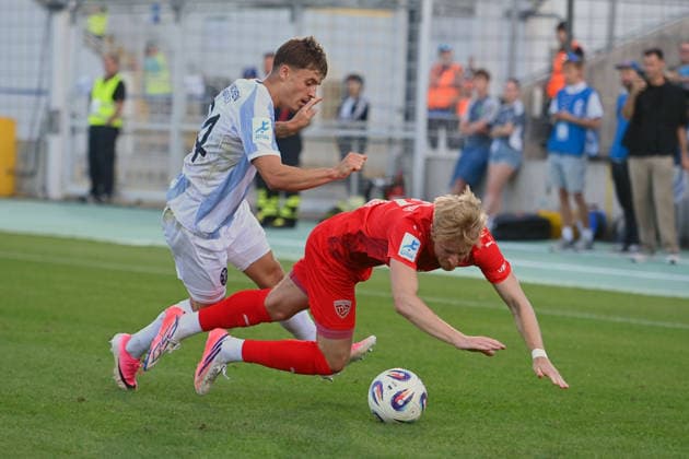 Jonas WESELSBERGER, Buchbach; Action; Tackle against Mark GEVORGYAN, TSV 1860 Munich, Bavarian State Soccer Cup, Toto Cup: TSV 1860 Munich vs. TSV Buchbach on September 1, 2026, at Grünwalder Stadium