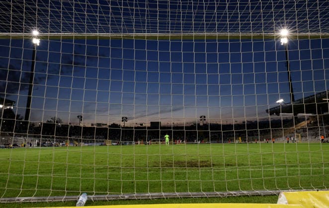 Soccer, Men s, Toto Cup, Round of 16, 2026–2027 Season, TSV 1860 Munich vs. TSV Buchbach, Grünwalder Stadium: Here’s a view of the field at Grünwalder Stadium—the municipal stadium on Grünwalder Street—with the West Stand visible behind the goal, along with the floodlights and the atmosphere at dusk