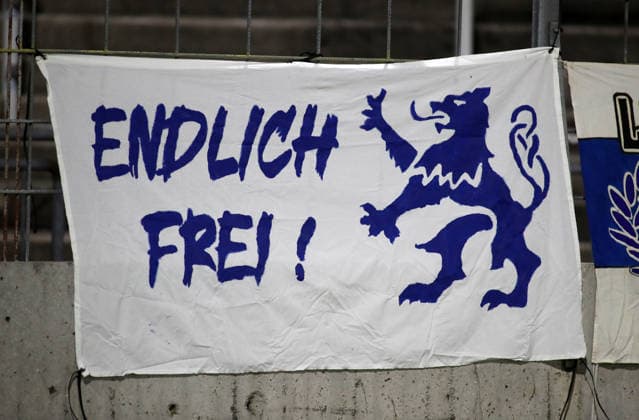 Soccer, Men s, Toto Cup, Quarterfinals, 2026–2027 Season, TSV 1860 Munich vs. TSV Buchbach at Grünwalder Stadium. Here is a banner from TSV 1860 Munich fans: Finally Free with a lion, Freedom for Sixty.