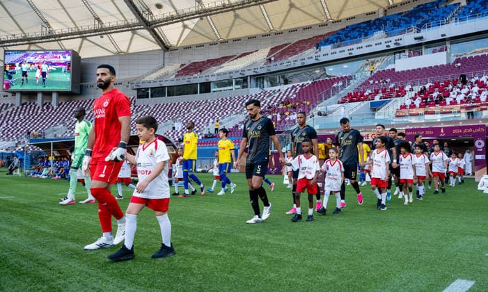 QATAR CUP 2026 SEMI-FINAL MATCH AL-SADD SC AND AL-GHARAFA SC Al-Sadd SC and Al-Gharafa SC players walk onto the pitch prior to the Qatar Cup 2026 semi-final match between Al-Sadd SC and Al-Gharafa SC at Khalifa International Stadium in Doha, Qatar, on September 1, 2026. DOHA Qatar Copyright: xNOUSHADx
