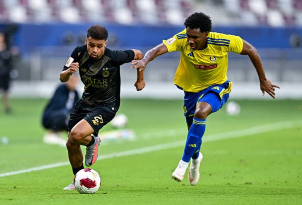 QATAR CUP 2026 SEMI-FINAL MATCH AL-SADD SC AND AL-GHARAFA SC Hashim Ali Ali (L) of Al Sadd SC and Saifeldeen Fadlalla of Al-Gharafa SC compete during the Qatar Cup 2026 semi-final match between Al-Sadd SC and Al-Gharafa SC at Khalifa International Stadium in Doha, Qatar, on September 1, 2026. DOHA Qatar Copyright: xNOUSHADx