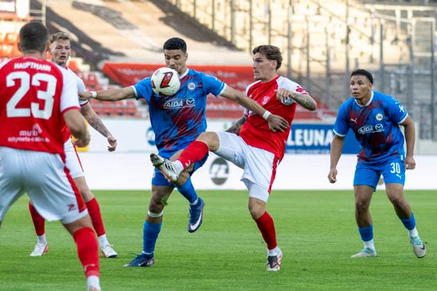 Regionalliga Nordost Season 26–27: Hallescher FC vs. SV Tasmania Berlin, Halle, Germany, September 2, 2026. Pictured, from left: Youssef Labbouz (Tasm Berlin) and Niclas Stierlin (Halle), Halle Saale Leuna Chemie Stadium, Saxony-Anhalt, Germany