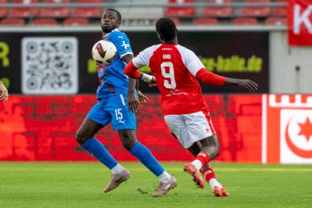 Regionalliga Northeast, Season 26-27: Hallescher FC vs. SV Tasmania Berlin, Halle, Germany, September 2, 2026. Pictured, from left, in a tackle: Jamilu Collins (Tasm Berlin) and Bocar Baro (Halle), Halle Saale Leuna Chemie Stadium, Saxony-Anhalt, Germany